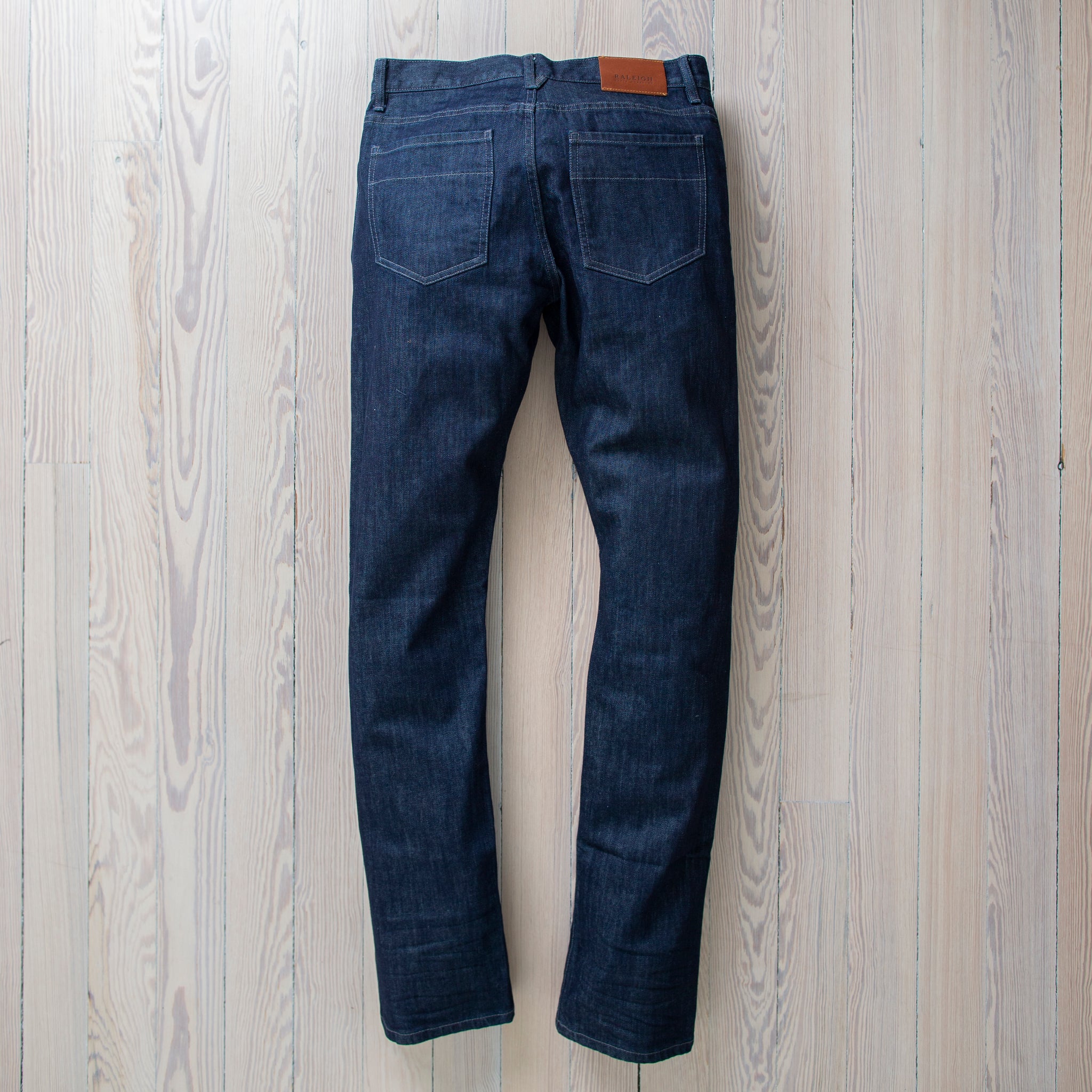 angle: resin rinse  Raleigh Denim Workshop Jones thin fit in a dark wash, front view