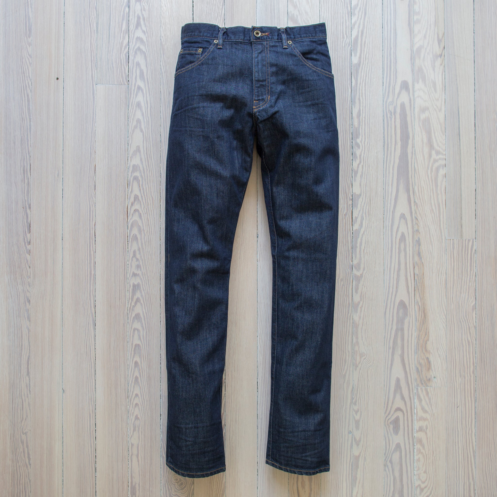 angle: resin rinse  Raleigh Denim Workshop Alexander work fit jeans with a dark wash, front view