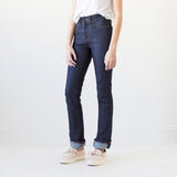 angle: indigo  A model wears Raleigh Denim Workshop Madison high-rise straight leg raw dark jeans, front view