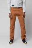 angle: Alexander Stretch Terracotta Man wears a Raleigh Workshop denim stretch jean pant in terracotta