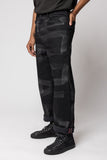 angle: Rowan Selvage Raw Hand Painted Black Vidalia  Man wearing black hand painted dark denim pants in black vidalia