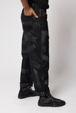 angle hover: Rowan Selvage Raw Hand Painted Black Vidalia  Man wearing black hand painted dark denim pants in black vidalia