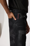 angle: Rowan Selvage Raw Hand Painted Black Vidalia  Man wearing black hand painted dark denim pants in black vidalia