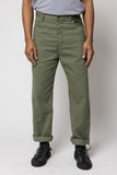 angle: Rowan Surplus Patchwork  man wears green patchwork rowan denim jeans