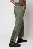angle: Rowan Surplus Patchwork  man wears green patchwork rowan denim jeans