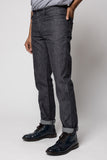 angle: Alexander Denim Tweed Man wears a Raleigh Workshop denim jean pant in tweed
