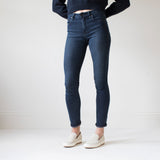 angle: canon  A model wears Raleigh Denim Workshop Haywood high-rise skinny jeans with a dark wash, side view