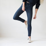 angle: canon  A model wears Raleigh Denim Workshop Haywood high-rise skinny jeans with a dark wash, front view