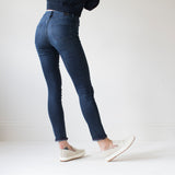 angle: canon  A model wears Raleigh Denim Workshop Haywood high-rise skinny jeans with a dark wash, back view
