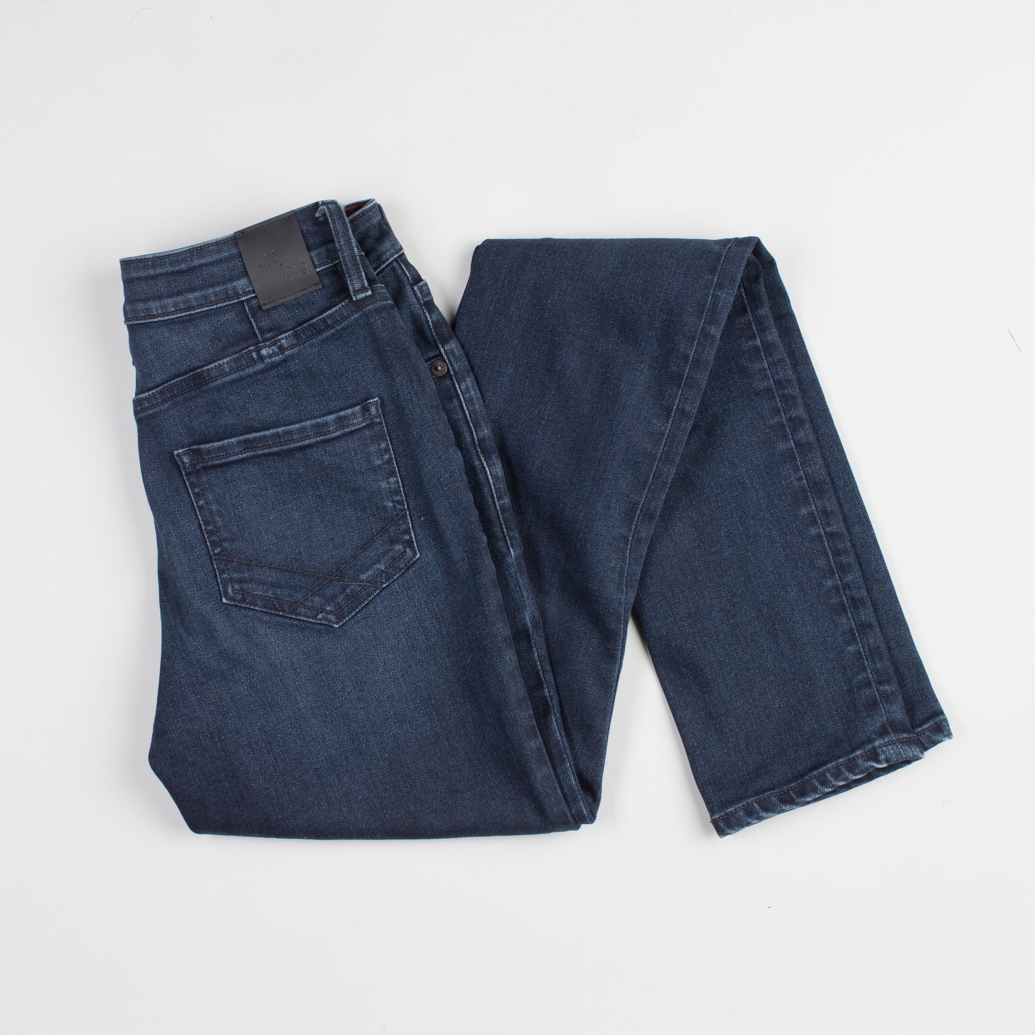 angle: canon  Raleigh Denim Workshop Haywood high-rise skinny jeans with a dark wash, back view