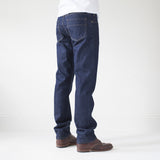 angle: resin rinse  A model wears Raleigh Denim Workshop Alexander work fit jeans with a dark wash, back view